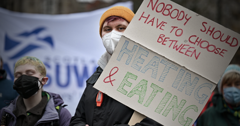 A demonstrator at a cost of living protest in Scotland